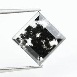 Premium lab-grown diamond with radiant square cut and distinctive black inclusions, offering a unique and sustainable choice for fine jewelry.