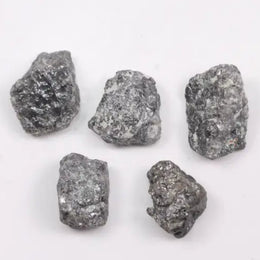 Gray diamond jewelry set with platinum and rose gold accents.muted shimmer and luxury appeal.
