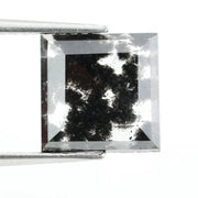 Premium lab-grown diamond with radiant square cut and distinctive black inclusions, offering a unique and sustainable choice for fine jewelry.