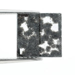 Premium lab-grown diamond with radiant square cut and distinctive black inclusions, offering a unique and sustainable choice for fine jewelry.