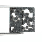 Premium lab-grown diamond with radiant square cut and distinctive black inclusions, offering a unique and sustainable choice for fine jewelry.