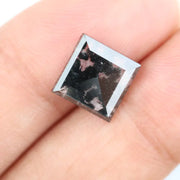 Premium lab-grown diamond with radiant square cut and distinctive black inclusions, offering a unique and sustainable choice for fine jewelry.