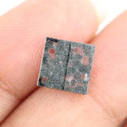 Premium lab-grown diamond with radiant square cut and distinctive black inclusions, offering a unique and sustainable choice for fine jewelry.