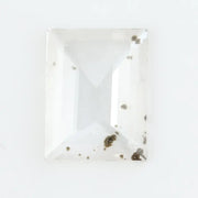 Emerald cut lab grown diamond loose stone with high clarity and subtle natural inclusions, transparent and ethically created for engagement ring or fine jewelry use
