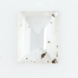 Emerald cut lab grown diamond loose stone with high clarity and subtle natural inclusions, transparent and ethically created for engagement ring or fine jewelry use