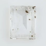 Emerald cut lab grown diamond loose stone with high clarity and subtle natural inclusions, transparent and ethically created for engagement ring or fine jewelry use