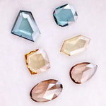 Fancy color lab grown diamonds in blue, yellow and champagne tones featuring cushion, oval, pear and geometric rose cut loose stones for custom jewelry.