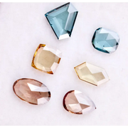 Fancy color lab grown diamonds in blue, yellow and champagne tones featuring cushion, oval, pear and geometric rose cut loose stones for custom jewelry.