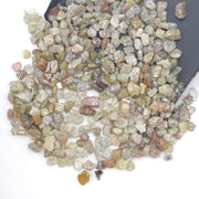 mixed color natural rough diamond chips displayed as loose uncut raw pieces