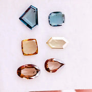 Fancy color lab grown diamonds in blue, yellow and champagne tones featuring cushion, oval, pear and geometric rose cut loose stones for custom jewelry.