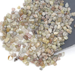 mixed color natural rough diamond chips displayed as loose uncut raw pieces