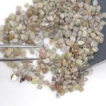 mixed color natural rough diamond chips displayed as loose uncut raw pieces