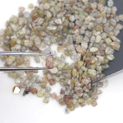 mixed color natural rough diamond chips displayed as loose uncut raw pieces