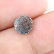 Close-up of a premium round cut brown lab-grown diamond with sparkling facets, showcasing eco-friendly, conflict-free quality and unique natural-like inclusions.