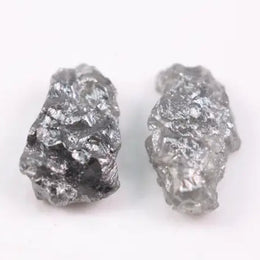 Raw natural gray diamond pair for bespoke jewelry. Unique, conflict-free diamond
