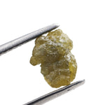 1.18 carat yellow raw diamond with a natural unpolished surface for a custom gold ring setting
