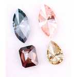 Set of four fancy color lab grown diamonds including emerald cut brown, pear shape yellow, marquise blue and pink loose diamonds for custom fine jewelry