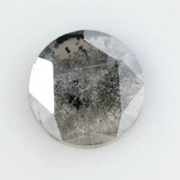 Round brilliant cut lab-grown salt and pepper diamond with unique gray and black inclusions, perfect for custom rings and fine jewelry.
