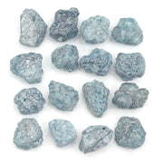 natural blue color rough diamond pieces arranged in an uncut loose diamond lot