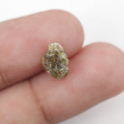 1.52 carat yellow natural diamond in its unpolished form for creating leaf-style jewelry designs.