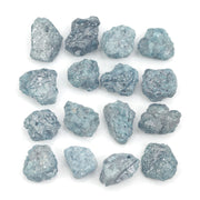 natural blue color rough diamond pieces arranged in an uncut loose diamond lot
