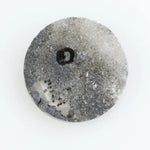 Round brilliant cut lab-grown salt and pepper diamond with unique gray and black inclusions, perfect for custom rings and fine jewelry.