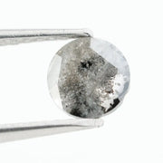 Round brilliant cut lab-grown salt and pepper diamond with unique gray and black inclusions, perfect for custom rings and fine jewelry.