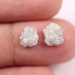Natural rough gray diamond pair featuring raw, uncut beauty.