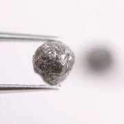 Conflict-free rough gray diamonds in organic matching pair for minimalist ring design