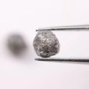 Conflict-free rough gray diamonds in organic matching pair for minimalist ring design
