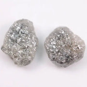 Raw gray diamond pair showing salt and pepper inclusions
