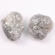 Raw gray diamond pair showing salt and pepper inclusions