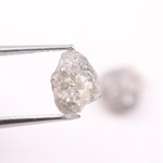 Raw gray diamond pair showing salt and pepper inclusions