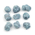 blue natural rough diamond pieces displayed for engagement ring and jewelry projects