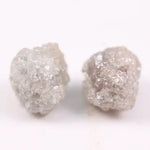 Rare uncut diamonds with organic texture and industrial elegance.