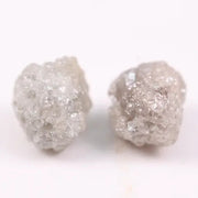 Rare uncut diamonds with organic texture and industrial elegance.
