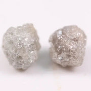 Rare uncut diamonds with organic texture and industrial elegance.