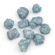 blue natural rough diamond pieces displayed for engagement ring and jewelry projects