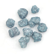 blue natural rough diamond pieces displayed for engagement ring and jewelry projects