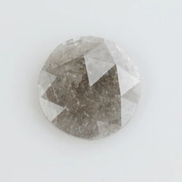 Round-cut salt and pepper lab-grown diamond with unique natural inclusions, ethically created for custom engagement rings and fine jewelry