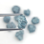blue natural rough diamond pieces displayed for engagement ring and jewelry projects