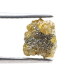Uncut yellow diamond in natural rough form, weighing 0.92 carats, suitable for a gold promise ring design