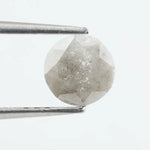 Round-cut salt and pepper lab-grown diamond with unique natural inclusions, ethically created for custom engagement rings and fine jewelry