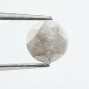 Round-cut salt and pepper lab-grown diamond with unique natural inclusions, ethically created for custom engagement rings and fine jewelry