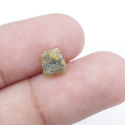 Uncut yellow diamond in natural rough form, weighing 0.92 carats, suitable for a gold promise ring design