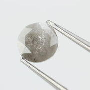 Round-cut salt and pepper lab-grown diamond with unique natural inclusions, ethically created for custom engagement rings and fine jewelry