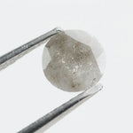 Round-cut salt and pepper lab-grown diamond with unique natural inclusions, ethically created for custom engagement rings and fine jewelry