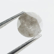 Round-cut salt and pepper lab-grown diamond with unique natural inclusions, ethically created for custom engagement rings and fine jewelry
