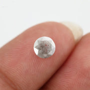 Round-cut salt and pepper lab-grown diamond with unique natural inclusions, ethically created for custom engagement rings and fine jewelry