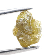 1.23-carat yellow raw diamond in its natural rough form, suitable for a gold band ring setting.